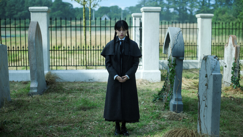 Jenna Ortega as Wednesday Addams stands in a graveyard in 'Wednesday' Season 2.