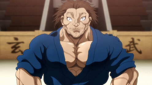 A heavily muscled and calm samurai Musashi Miyamoto standing in a fighting arena.
