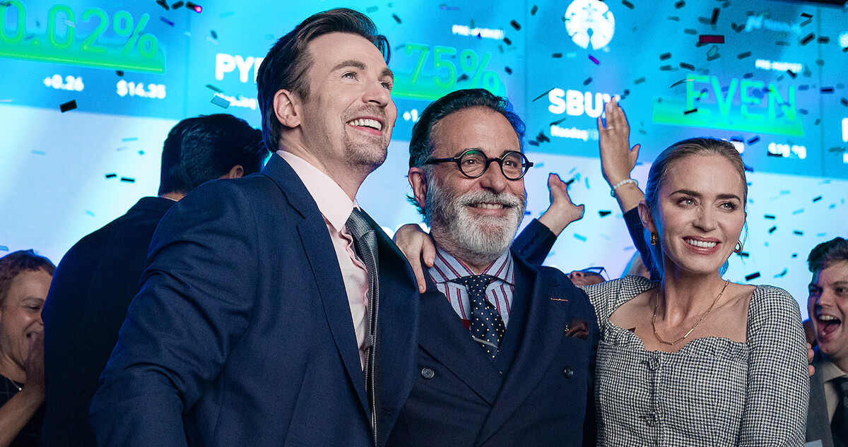 Chris Evans, Andy Garcia and Emily Blunt celebrate in a scene from 'Pain Hustlers.'