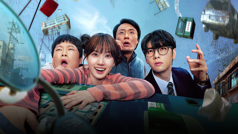 Four people with surprised expressions inside a tilting bus, floating debris and buildings in a chaotic city scene, suggesting an intense or supernatural event.