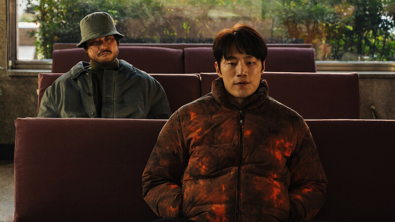 Kim Sung-kyun sits behind Lee Hee-jun in an image from the series 'Karma.'