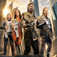 Four wrestlers stand confidently wearing championship belts in a futuristic cityscape with tall skyscrapers and glowing sunlight, displaying strength and determination.