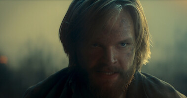 Bearded protagonist in Ragnarok looking determined and angry.