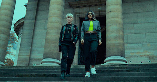 Marina Foïs as Selma and Lina El Arabi as Lyna walk down the steps of a large stone building in Season 1 of 'Furies.'