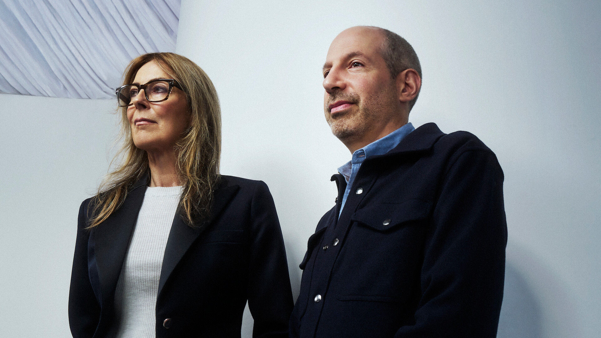 Kathryn Bigelow and Noah Oppenheim against a white backdrop.