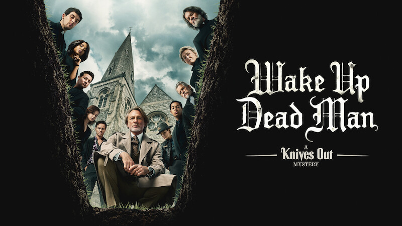 The Cast of Wake Up Dead Man looks into a grave