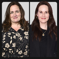 Two women are pictured side by side against a plain background; the woman on the left wears a floral print blouse, while the woman on the right is dressed in black with jewelry, both smiling in a well-lit studio setting.