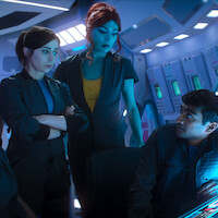 Cristin Milioti, Milanka Brooks, and Paul G. Raymond in Season 7 of ‘Black Mirror’ in Season 7 of ‘Black Mirror’