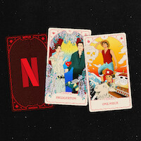 Three playing cards on a black surface: one with the Netflix logo, one shows Bridgerton characters in formalwear, and one shows One Piece anime characters with bright cartoon backgrounds and settings.