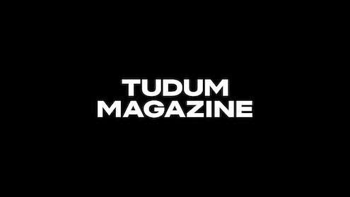 Tudum Magazine logo in white on a black background.