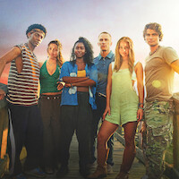 Six young adults stand on a dock at sunset, dressed in casual summer clothes, looking at the camera with serious expressions. The sky is colorful, creating a warm and adventurous atmosphere.