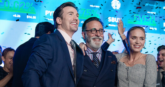 Chris Evans, Andy García, and Emily Blunt celebrate in a still from 'Pain Hustlers.'