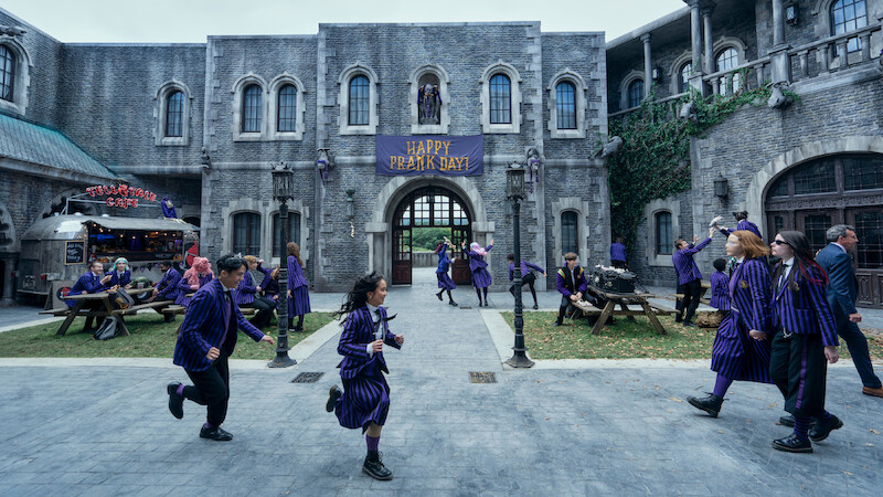 Students in the Nevermore Academy courtyard in ‘Wednesday’ Season 2.