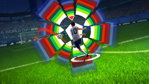 Soccer player in white jersey taking a shot on goal in a stadium, with colorful digital graphics showing trajectory and power settings, crowd and banners visible in the background.