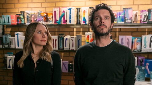 Kristen Bell as Joanne looks up at Adam Brody as Noah in a sex shop in Season 1 of 'Nobody Wants This'