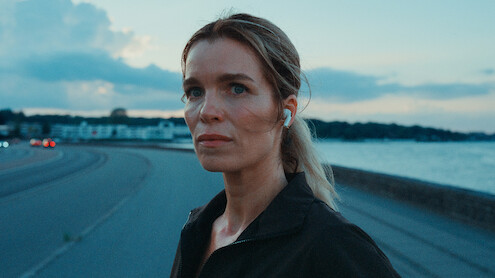 Marie Bach Hansen as Cecile looks down a coastal road in 'The Royals.'