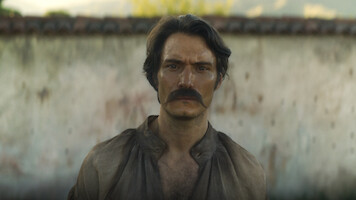 Claudio Cataño as Colonel Aureliano Buendía stands with an intense introspective expression in 'One Hundred Years of Solitude'