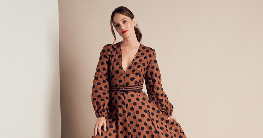 A glamor shot of Leighton Meester in a brown dress with black polkadots