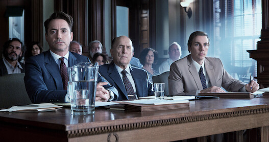 Robert Downey Jr., Robert Duvall, and Dax Shepherd sitting in a courtroom.