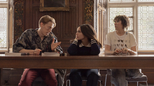 Harry Trevaldwyn as Charlie, Sofia Carson as Anna and Esmé Kingdom as Maggie talk in a classroom in 'My Oxford Year.'