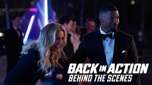 Cameron Diaz laughing next to Jamie Foxx on the set of 'Back in Action'.