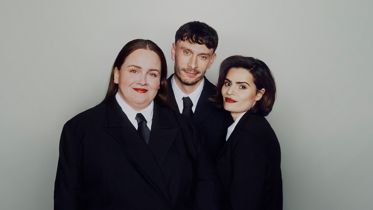Jessica Gunning, Richard Gadd, and Nava Mau wear suits and pose against a light gray background.