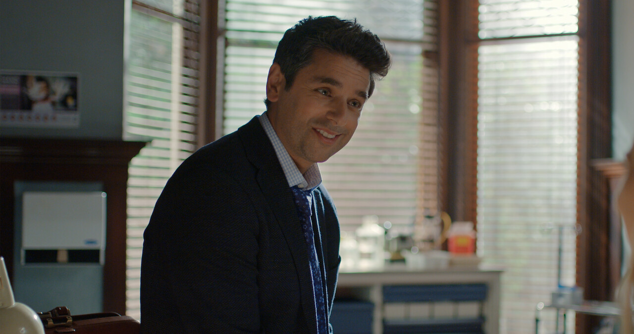 Man in suit smiling