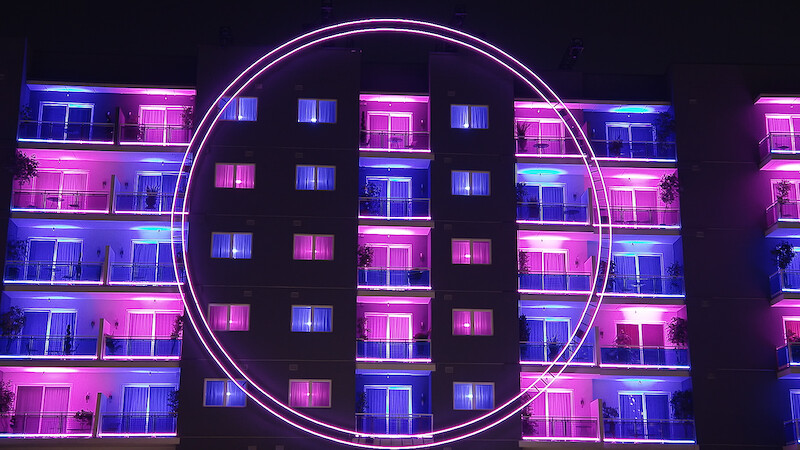 An exterior view of 'The Circle' apartments from Season 6.