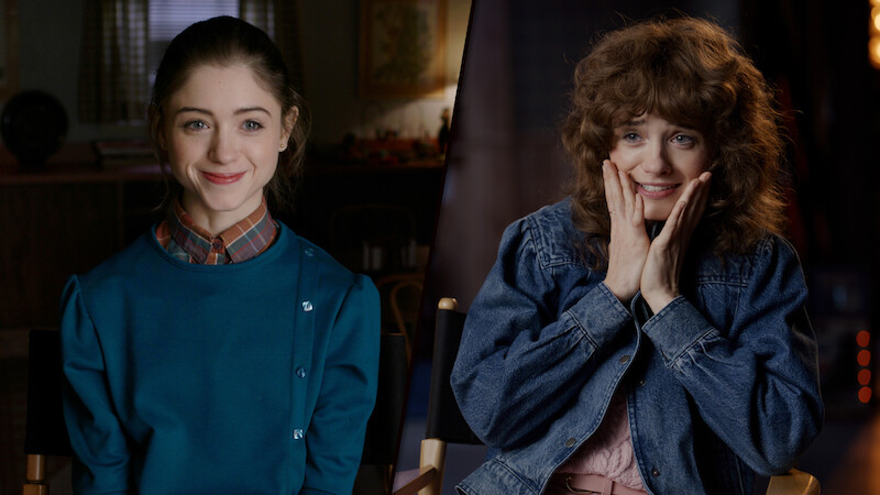 A split-image of Natalia Dyer at two different ages: younger on the left, sitting in a vintage-style room and smiling calmly; older on the right, in a softly lit modern setting, wearing a denim jacket and expressing excitement.