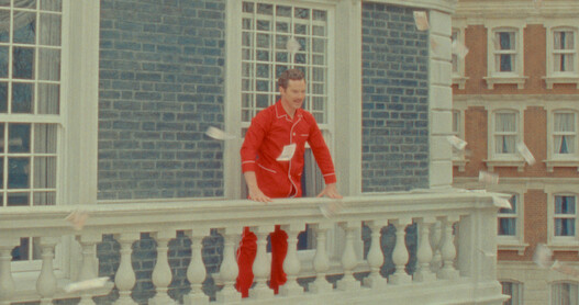 Benedict Cumberbatch stands on a balcony as Henry Sugar in 'The Wonderful Story of Henry Sugar.'